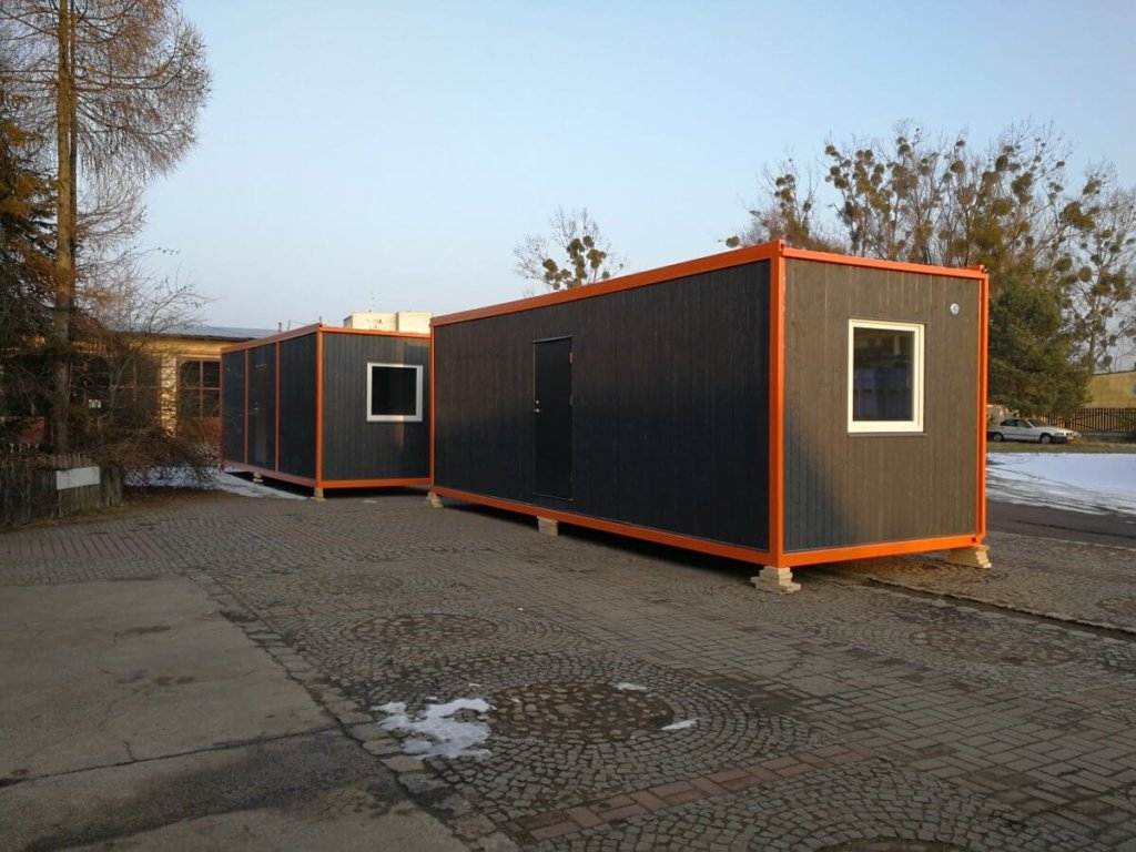 Ready grey containers with wood facade